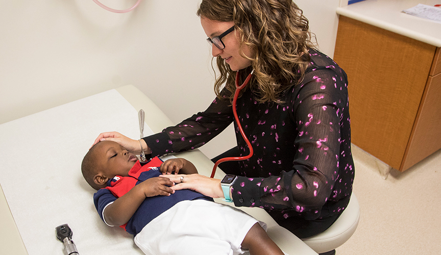 infantile epilepsy patient being assessed by Dr. Amy Patterson in neuro clinic